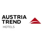 Austria Trend Hotels Logo mit schwarzem Text und einer roten geometrischen Form, die an ein stilisiertes Dreieck oder einen Berg erinnert, auf weißem Hintergrund.