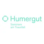 Logo für Humergut Seminare am Traunfall mit einem stilisierten geometrischen Symbol aus vier abgerundeten Formen, die zu einem Quadrat angeordnet sind.